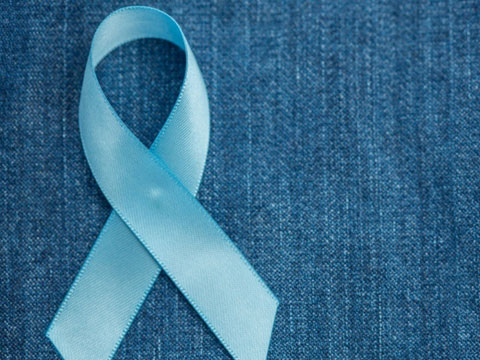 Prostate Cancer Awareness Ribbon on Denim Background. 