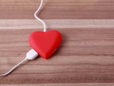 Cords plugged in to heart shaped charger. 