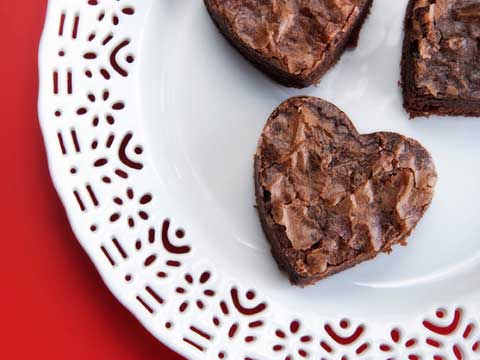 Heart shaped brownies on a plate. 