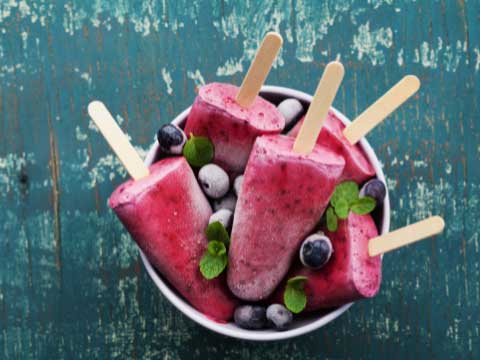 Bowl of fruity ice pops. 