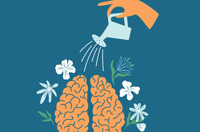 Watering a brain with flowers around it. 
